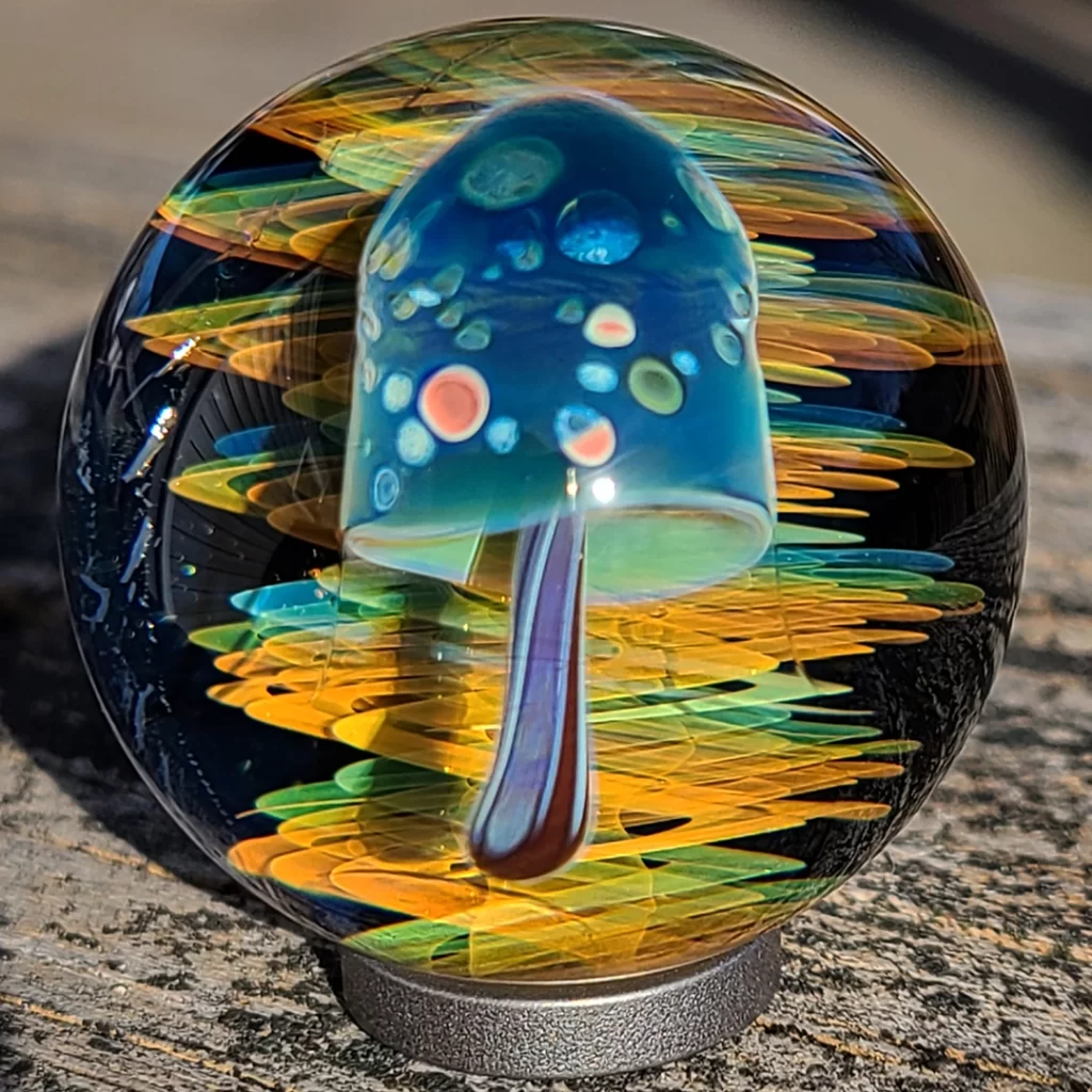 glass marble with a mushroom inside